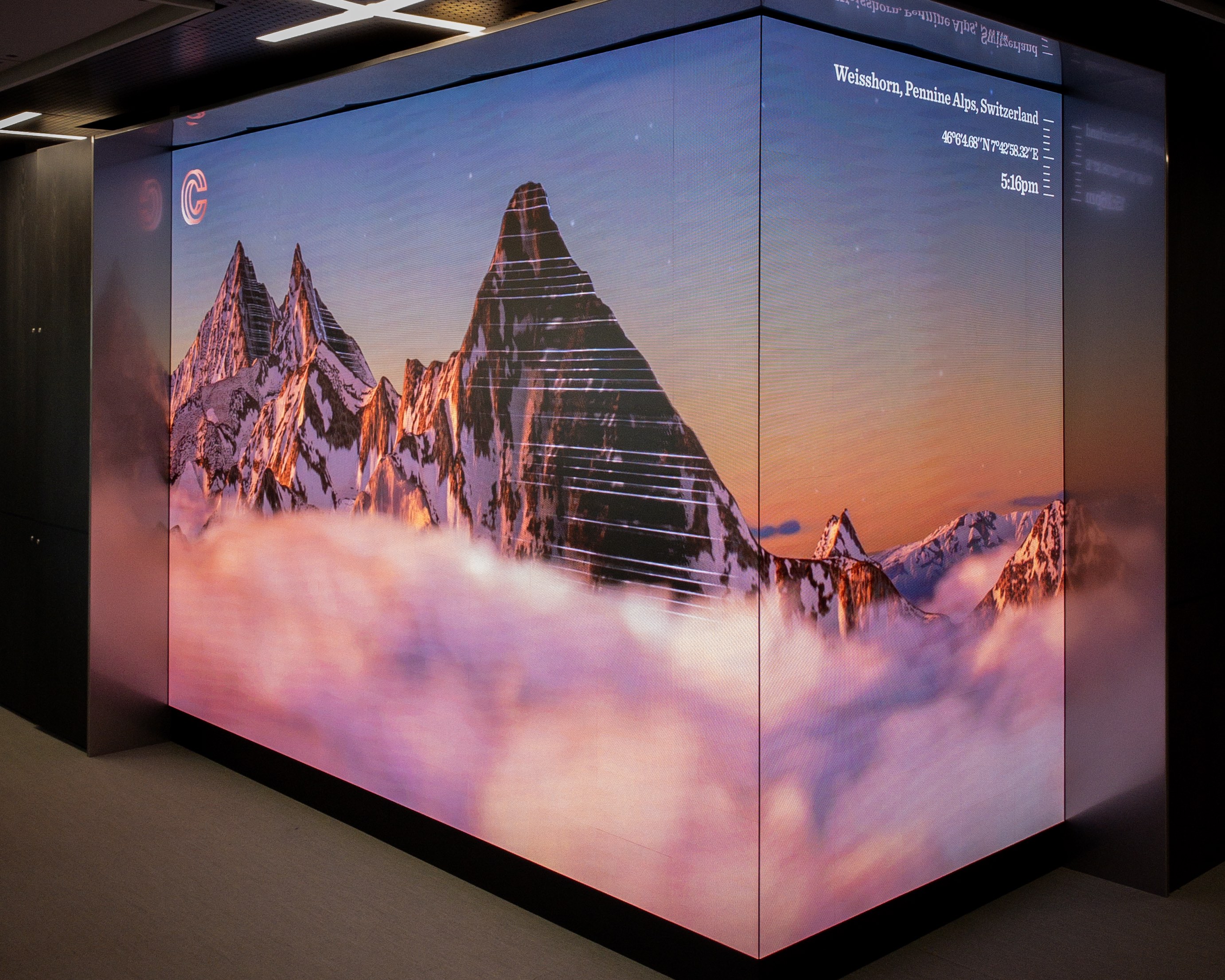 A virtual screen showing mountains in Switzerland.