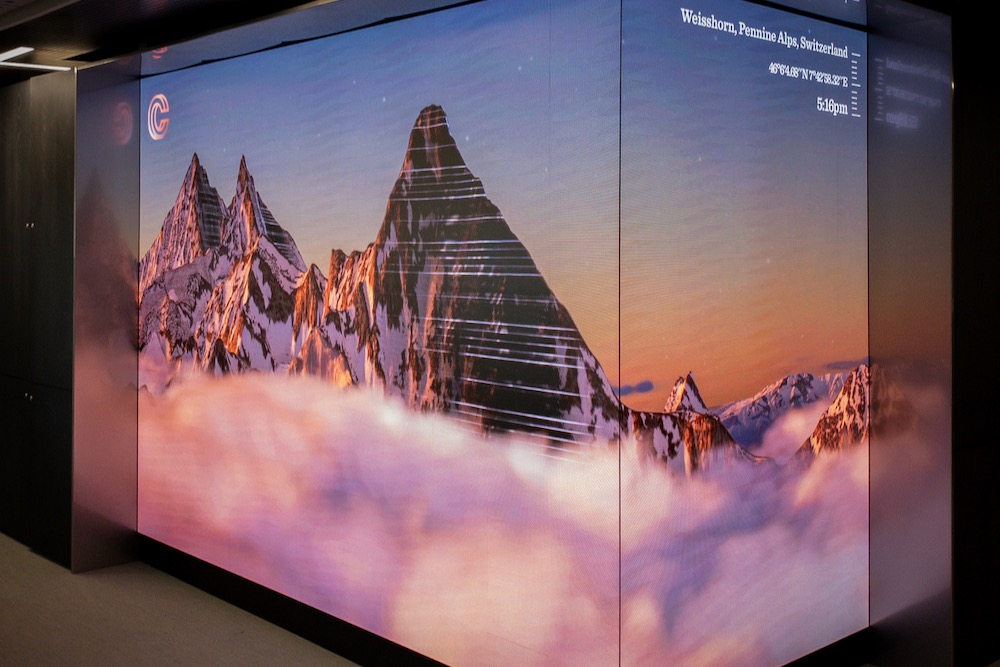 A virtual screen showing mountains in Switzerland.